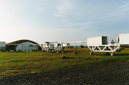 [A colour picture of the telescopes and beam combining building]